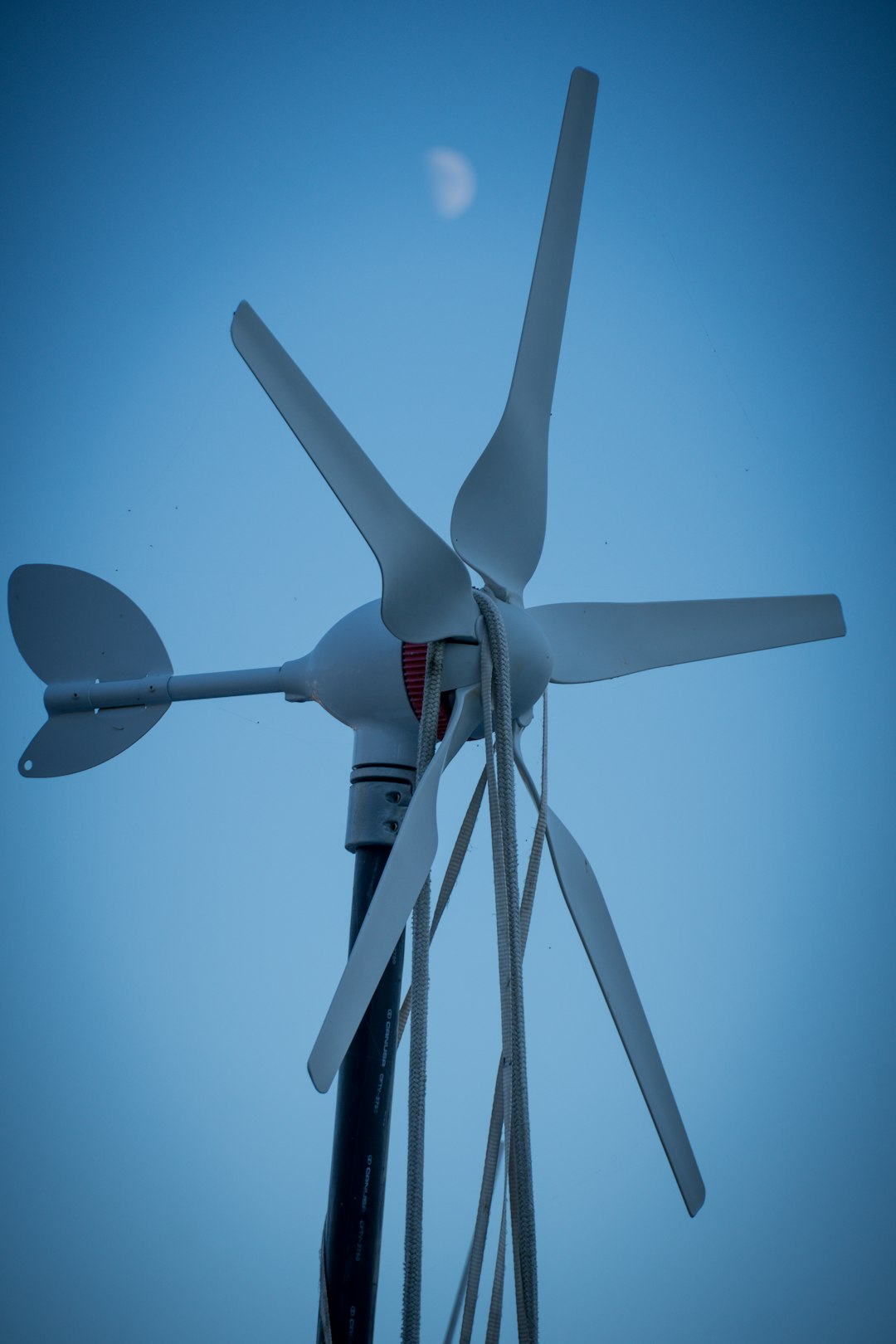 who-we-are wind-turbine-with-the-moon-in-the-background-8xayzb5wjmk